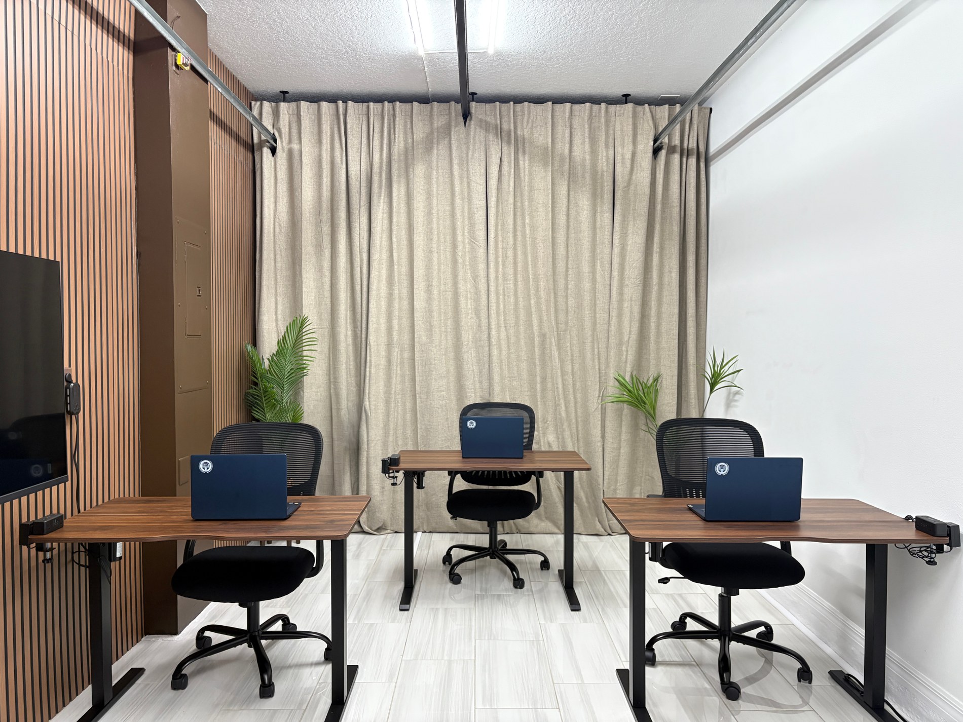Three student workstations in the converted garage classroom at Provident Scholars